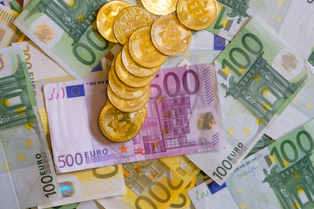 Gold Bitcoins, Crypto currency and Euro banknotes, virtual moneyの写真素材