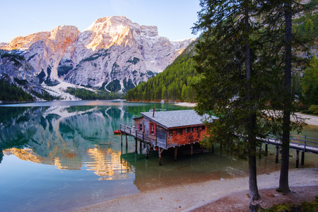 Beautiful Braies lake and house in the background of Seekofel mountain in Dolomites,Italy ( Pragser Wildsee )の写真素材