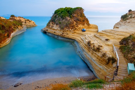 Famous Canal d'Amour beach with beautiful rocky coastline in amazing blue Ionian Sea at sunrise in Sidari holiday village on Corfu island in Greece,Europeの写真素材