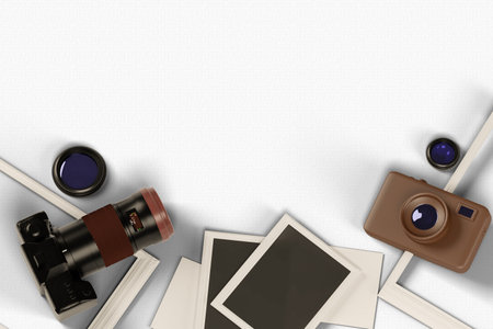 top view of retro camera with blank photo frames on white paper backgroundの写真素材