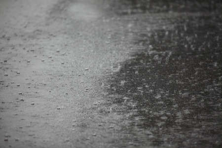 Raining on asphaltの写真素材