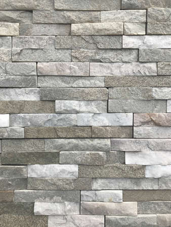 A wall of stone. Natural background and wall of the building.