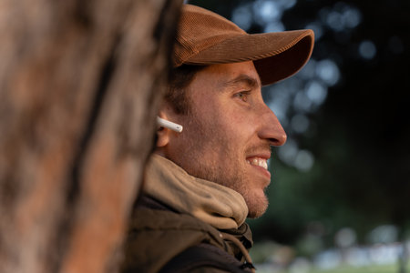 Closeup of a smiling man with headphones listening to music
