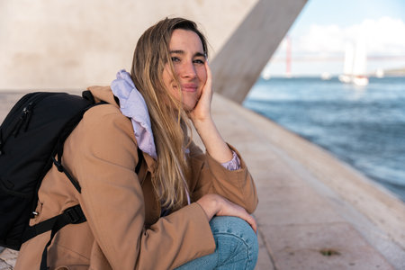 Portrait of a woman smiling in an urban environment.の写真素材