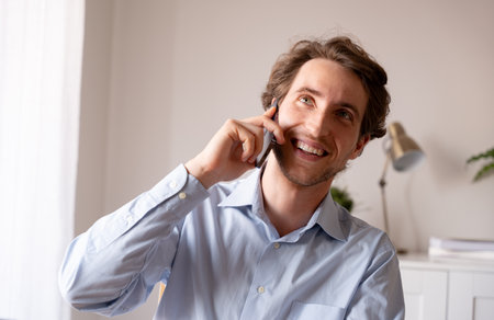 Business owner in a hybrid environment working happily and productively in their telecommuting spaceの写真素材