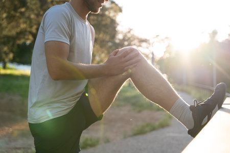 Man stretching after outdoor running sessionの写真素材