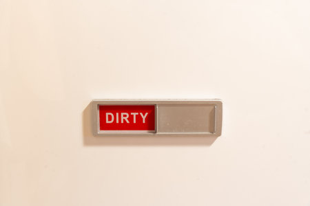 Dishwasher status indicator displaying dirty dishes conceptの写真素材