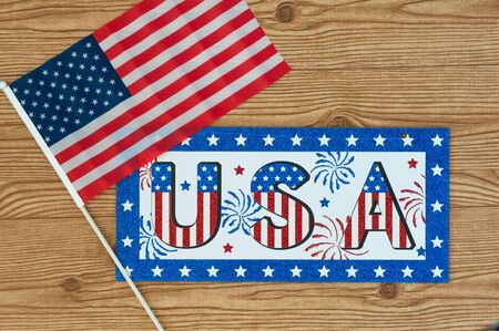 Independence Day July 4th, President's Day, Memorial Day, Labor Day, Veteran's Day, Great America. USA sign in the colors of the flag of the United States on a wooden background with the flag.の写真素材