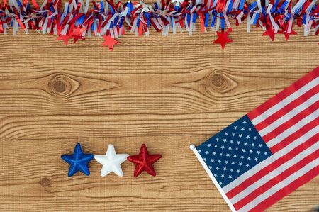 Celebrating Independence Day July 4th, President's Day, Memorial Day, Labor Day, Veteran's Day, Great America. United states flag on a wooden background with blue, white and red stars.の写真素材