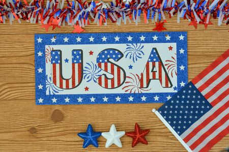 Independence Day July 4th, President's Day, Memorial Day Labor Day, Veteran's Day, Great America. USA sign in the colors of the flag of the United States on a wooden background with stars and the flagの写真素材