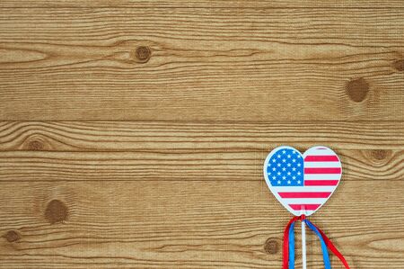 Celebrating Independence Day July 4th, President's, Memorial, Labor and Veteran's Day, Great America. Minimalist background with a heart in the form of the flag of the United States.の写真素材
