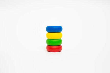 Toy wooden blocks, multicolor building construction bricks over white background. Early education concept.の写真素材