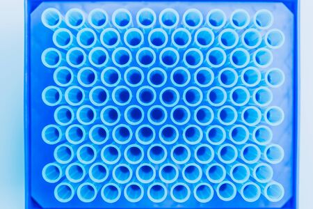 Top view of empte blue test tubes background. Science, chemistry, biology and medicine concept.の写真素材