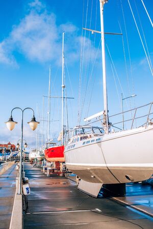 Sailing multicolored boats ready for launching after winter storage.の写真素材