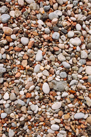 The texture of the little pebbles on the beach. Shoot from above space for messageの写真素材
