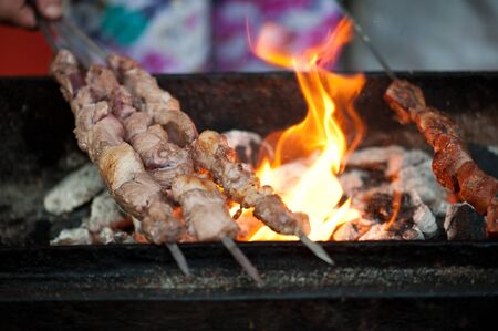 Flames grilling skewers at Muslim Street in Xian, Chinaの写真素材