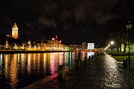 Norrkoping, Sweden - December 20, 2008: Christmas decorations and lights along the river Motala Stream in downtown Norrkoping, Sweden on a dark December night.のeditorial素材