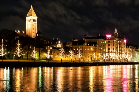 Norrkoping, Sweden - December 20, 2008: Christmas decorations and lights along the river Motala Stream in downtown Norrkoping, Sweden on a dark December night.のeditorial素材