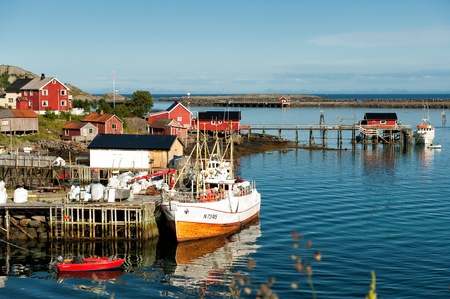 Reine, Norway - July 4, 2011: Fishing harbor in Reine at Lofoten islands in northern Norway on a sunny summer evening. Reine is a picturesque fishing village and a popular travel destination.のeditorial素材