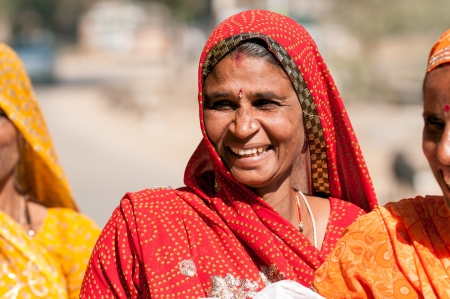 Ranthambore, India  February 4, 2011: Portrait of a colorfully dressed smiling Rajasthani woman with a caste mark. Almost 90% of Rajasthani people are Hindus.のeditorial素材