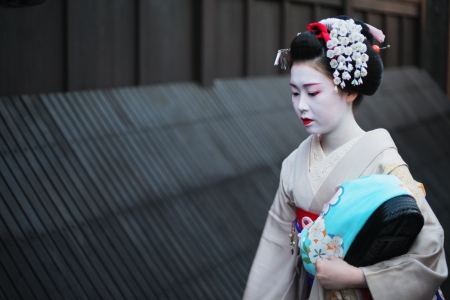 Kyoto, Japan - April 8, 2013: Geisha approaching a famous tea house in the Gion district of Kyoto. The Geisha in Gion are the highest ranked in Japan.のeditorial素材