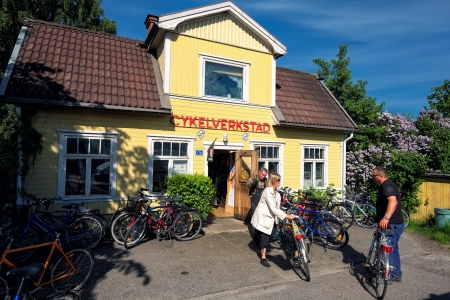 Norrkoping, Sweden - June 5, 2013  Outside an idyllic old bicycle repair shop on a sunny afternoon in early June のeditorial素材