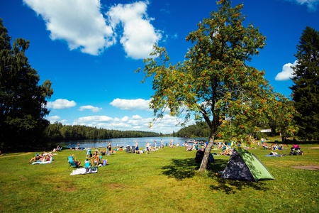 Norrkoping, Sweden - August 4, 2013  Summer in Sweden - people enjoying a sunny day by a lakeのeditorial素材