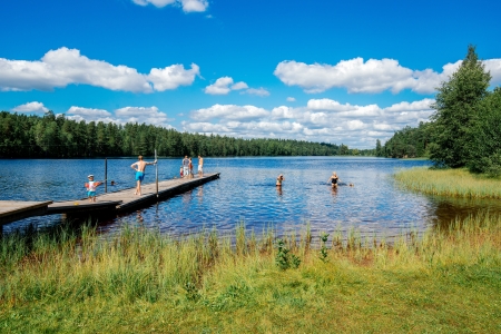 Norrkoping, Sweden - August 4, 2013  Summer in Sweden - people enjoying a sunny day by a lakeのeditorial素材