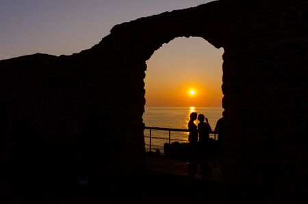 Cefalù, Sicily, Italy  July 17, 2013  Tourists enjoy the sunset in Cefalù, Sicily  Cefalù is one of the most popular destinations for a Sicilian vacationのeditorial素材