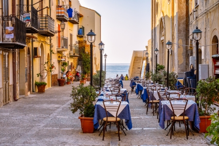 Cefalù, Sicily, Italy  July 17, 2013  A square with a trattoria  waiting for customers in the old town of Cefalù  Cefalù is one of the most popular destinations for a Sicilian vacation のeditorial素材