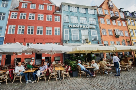Copenhagen, Denmark - August 21, 2013  Tourists enjoy lunch in Nyhavn, Copenhagen  Nyhavn is a 17th-century waterfront, canal and entertainment district and a major tourist attraction in Copenhagen のeditorial素材