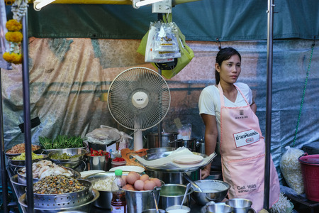 Hua Hin, Thailand  February 27, 2013  Thai woman running a street food stall at the night market in Hua Hin  The famous night market in Hua Hin is a major tourist attraction のeditorial素材