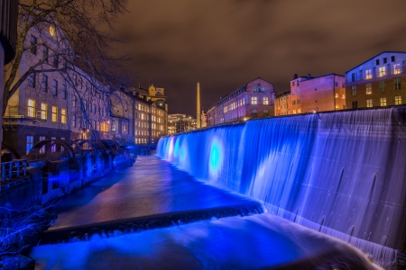 Blue Christmas - the illuminated waterfall in the famous industrial landscape in Norrkoping, Sweden at Christmas time の写真素材