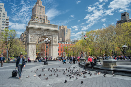 New York, USA – May 1, 2014  A sunny spring day in Washington Square Park – an iconic park and a...