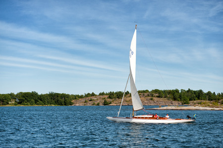 Gryt, Sweden  July 22, 2009  Classic M30 sailing boat cruises through the archipelago of Gryt  This archipelago is a popular destination for leisure boats during summer のeditorial素材