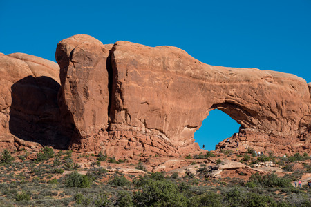 Moab, UT, USA - October 4, 2014: Tourists explore one of many thousand arches in Arches National Park.のeditorial素材