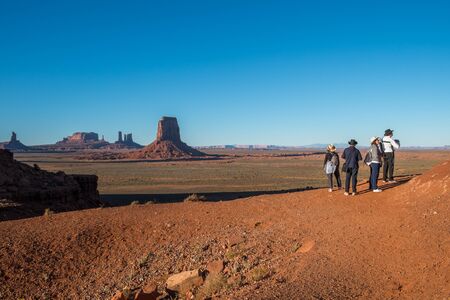 Monument Valley, AZ, USA - October 5, 2014: Tourists explore the North Window in Monument Valley. The landscape in Monument Valley is one of the most iconic in USA.のeditorial素材
