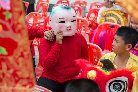 Hua Hin, Thailand - February 18, 2015: Thai school boys celebrating Chinese New Year in Hua Hin. In Thailand New Year is celebrated on three occasions - the Gregorian, the Chinese and Songkran.のeditorial素材