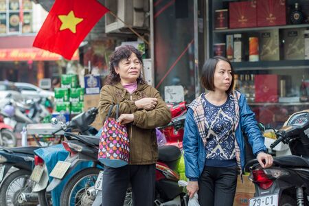 Hanoi, Vietnam - February 15, 2015: Street scene in the old quarter of Hanoi. The 36 old streets and guilds of the old quarter are a major tourist attraction.のeditorial素材