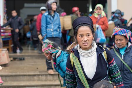 Sapa, Vietnam - February 13, 2015: Hmong woman at a market in Sapa. Sapa is famous for its rugged scenery and its cultural diversity. Hmong people are one of many colorful tribes.のeditorial素材