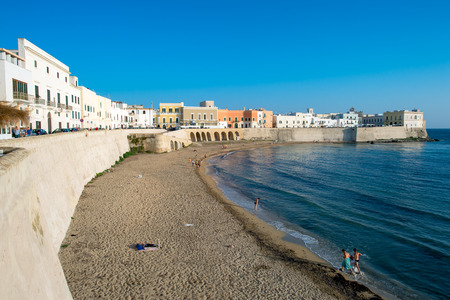 Gallipoli, Italy  June 14, 2015: The beach and Old Town in Gallipoli. The name of this picturesque old city on the Salentina Peninsula comes from Greek Kallipolis, which means beautiful city.のeditorial素材
