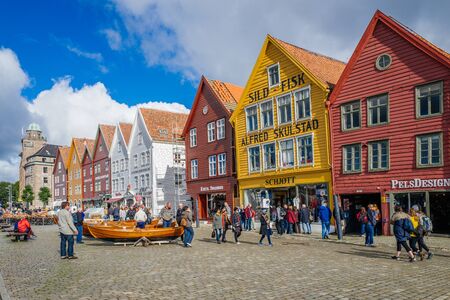 Bergen, Norway  September 5, 2015: Tourists enjoy Norways most visited tourist attraction Bryggen. Bryggen is a series of old Hanseatic commercial buildings and a UNESCO World Heritage site.のeditorial素材