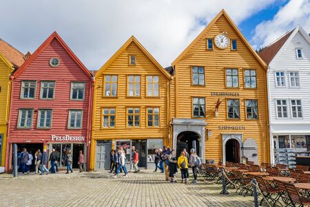 Bergen, Norway  September 5, 2015: Tourists enjoy Norways most visited tourist attraction Bryggen. Bryggen is a series of old Hanseatic commercial buildings and a UNESCO World Heritage site.のeditorial素材