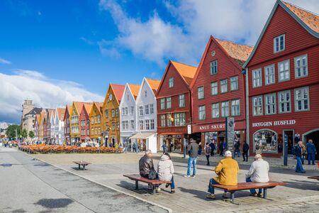 Bergen, Norway  September 5, 2015: Tourists enjoy Norways most visited tourist attraction Bryggen. Bryggen is a series of old Hanseatic commercial buildings and a UNESCO World Heritage site.のeditorial素材