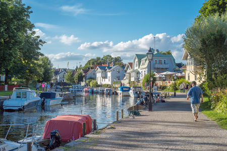 Trosa, Sweden  August 6, 2015: Leisure boats moored at the harbor along the outflow of Trosa river into the Baltic sea. Trosa is an idyllic and historic seaside town south of Stockholm and a popular tourist destination during summer time.のeditorial素材