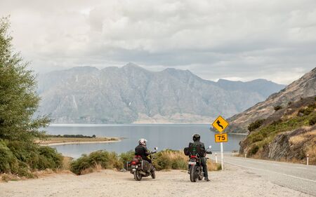 Lake Hawea, New Zealand  February 13, 2012: Motorbikers admire the view of Lake Hawea on their way to Queenstown. South Island is a bikers paradise due to its spectacular scenery.のeditorial素材