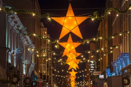 Norrkoping, Sweden  December 21, 2014: Christmas decorated street in Norrkoping. Norrkoping, a historic industrial town and a center of education, is illuminated during Christmas time.のeditorial素材