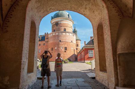 Mariefred, Sweden - August 4, 2011: Tourists visit Gripsholm Castle in Mariefred. This is a royal castle that now is a museum and a popular tourist attraction.のeditorial素材