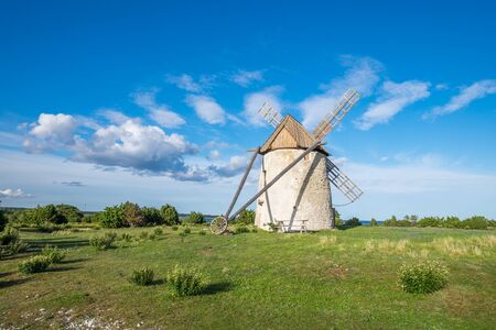 Old windmill on Baltic sea island Gotland during summer in Swedenの写真素材