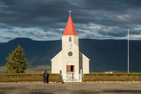 Glaumbaer, Iceland - August 16, 2016: Tourists take photos at Glaumabaer church. This is a popular tourist stop between Saudarkrokur and Varmahlid in Iceland.のeditorial素材